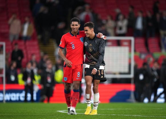 Jude Bellingham Borussia Dortmund of England & Jamal Musiala Bayern Munich of Germany at full time during the Nations League international match, L�nderspiel, Nationalmannschaft between England an ...