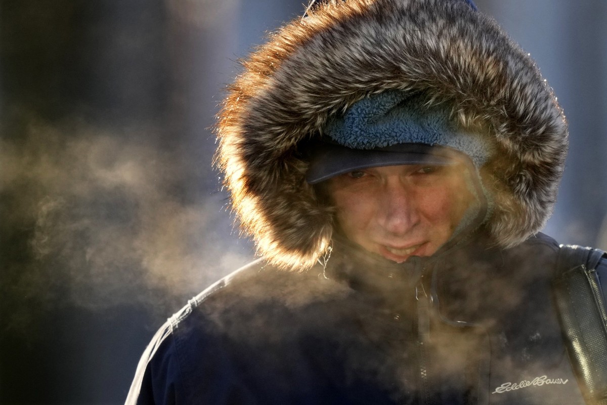 FILE - A passenger disembarks from a ferry arriving from Peaks Island, Feb. 4, 2023, in Portland, Maine. United States winter looks likely to be a bit low on snow and extreme cold outbreaks, with fede ...