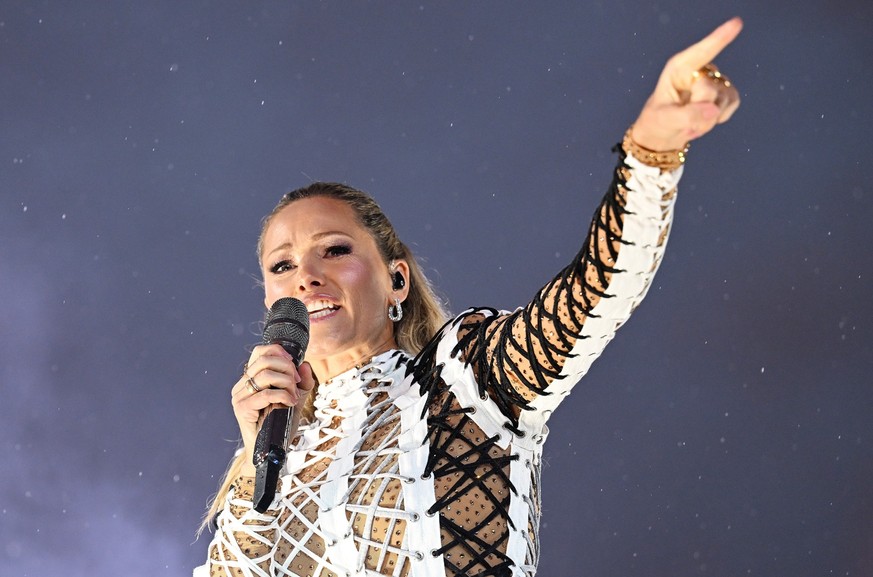 20.08.2022, Bayern, München: Helene Fischer singt bei ihrem Open-Air-Konzert in der Messe München. Es ist ihr Comeback und das einzige Deutschland-Konzert 2022. Foto: Angelika Warmuth/dpa +++ dpa-Bild ...