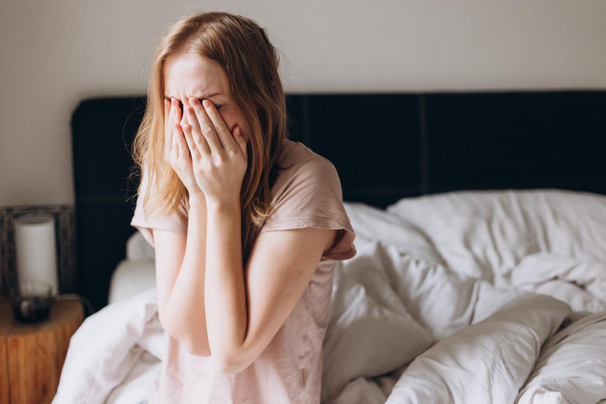 Close up young woman feeling upset, sad, unhappy or disappoint crying lonely in bedroom. Emotional shock, life problems