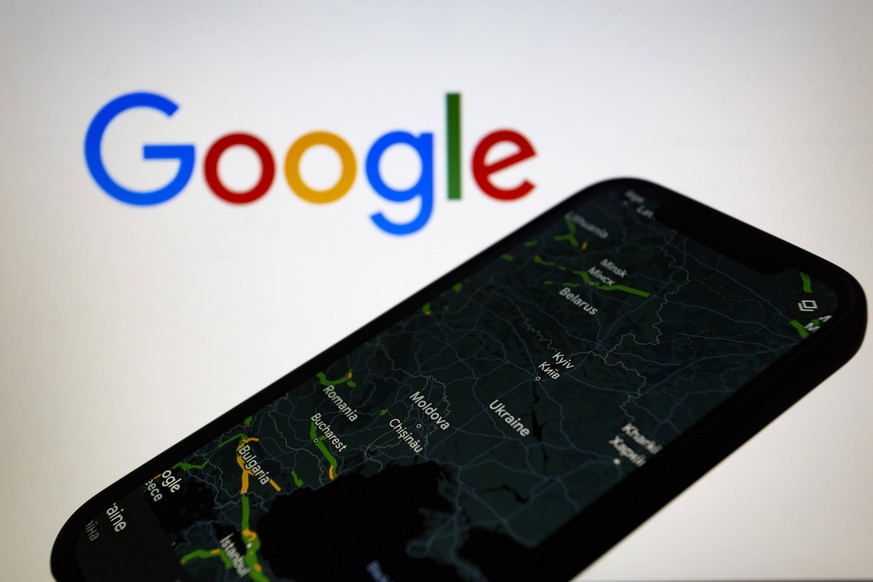 February 27, 2022, Asuncion, Paraguay: Illustration: Google Maps is displayed on a smartphone backdropped by Google logo. Google temporarily disables Google Maps live traffic data in Ukraine. Asuncion ...