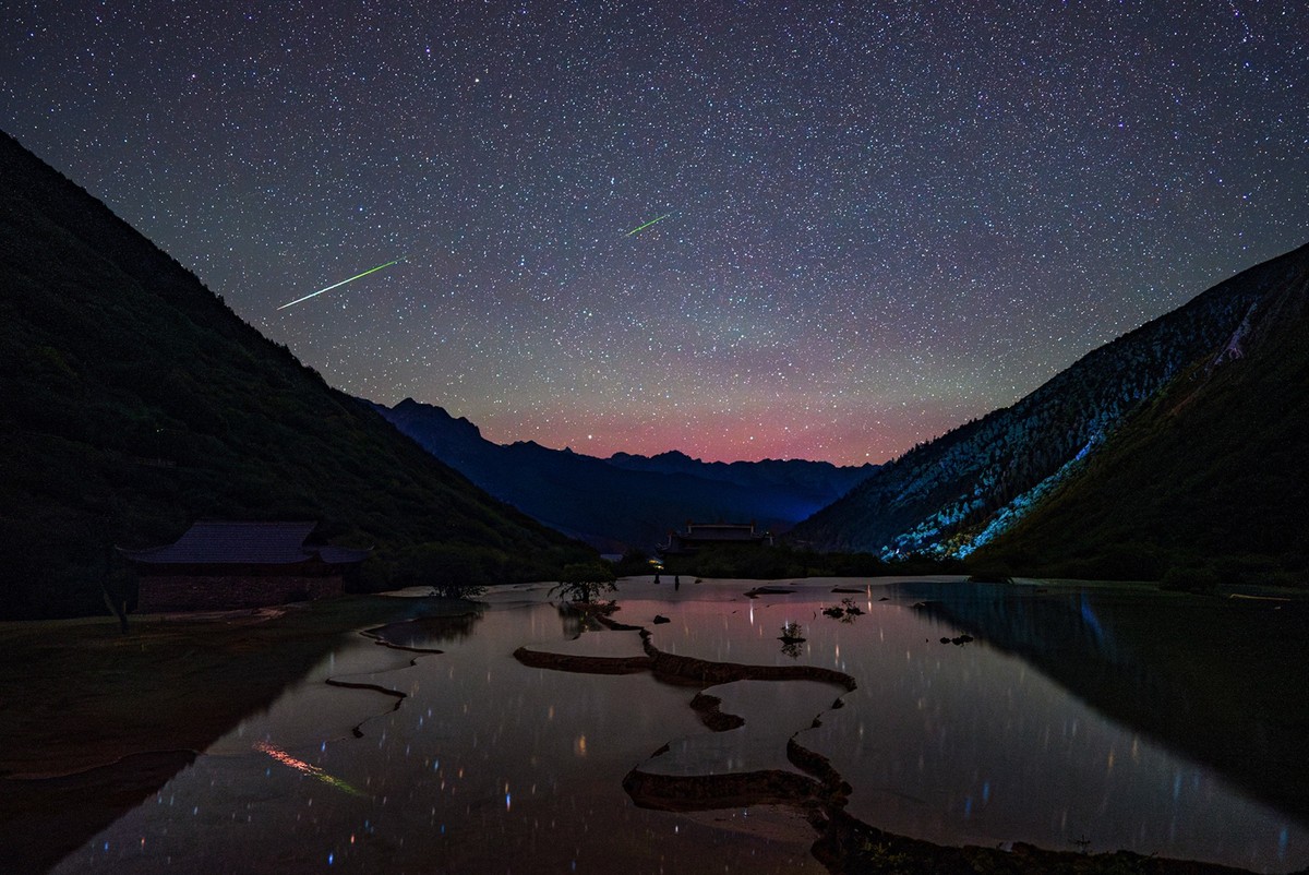 240813 -- ABA, Aug. 13, 2024 -- This photo taken on Aug. 12, 2024 shows Perseid meteor shower over Huanglong Scenic and Historic Interest Area in Aba Tibetan and Qiang Autonomous Prefecture, southwest ...