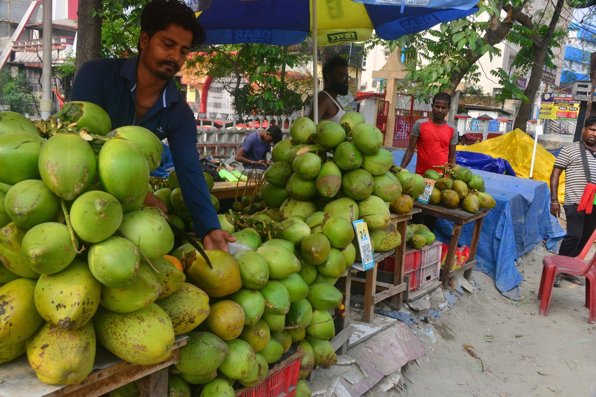 India Weather Summer Economy Indian vendors sell coconuts at a roadside stall in Siliguri, India, on April 26, 2025. Coconut is in heavy demand during the summer months in India as people quench their ...