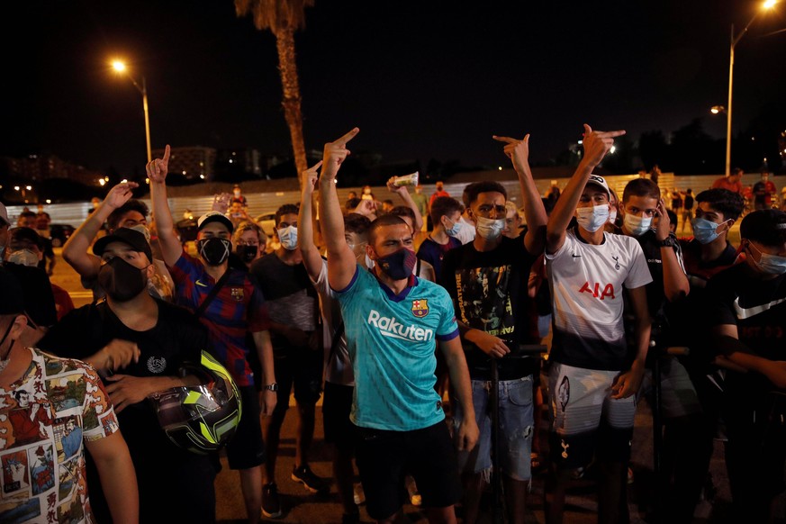 Dozens of FC Barcelona, Barca fans gather outside Camp Nou Stadium to demand the resignation of the club s president, Josep Maria Bartomeu, after Argentinian star Lionel Messi stated via fax his inten ...