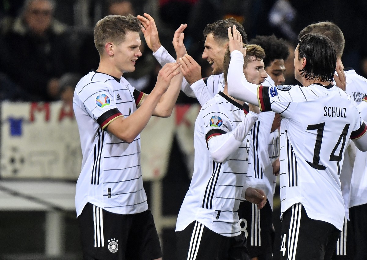 Germany's Matthias Ginter, left, is celebrated after he scored the opening goal during the Euro 2020 group C qualifying soccer match between Germany and Belarus in Moenchengladbach, Germany, Satu ...