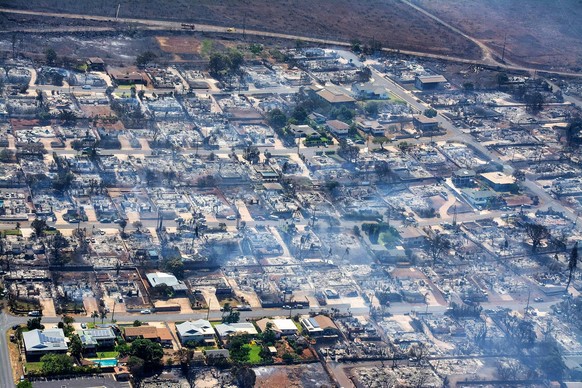 August 10, 2023, Maui, Hawaii, USA: An aerial photo shows destroyed buildings and burned trees from the wildfire. The death toll from the fast-moving wildfires from Hawaii has increased to 36 people,  ...