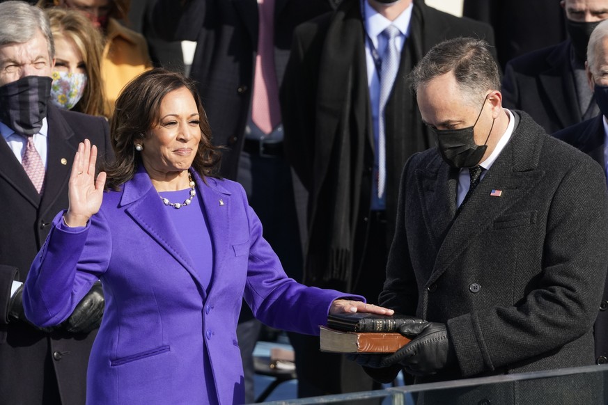 Kamala Harris is sworn in as vice president by Supreme Court Justice Sonia Sotomayor as her husband Doug Emhoff holds the Bible during the 59th Presidential Inauguration at the U.S. Capitol in Washing ...