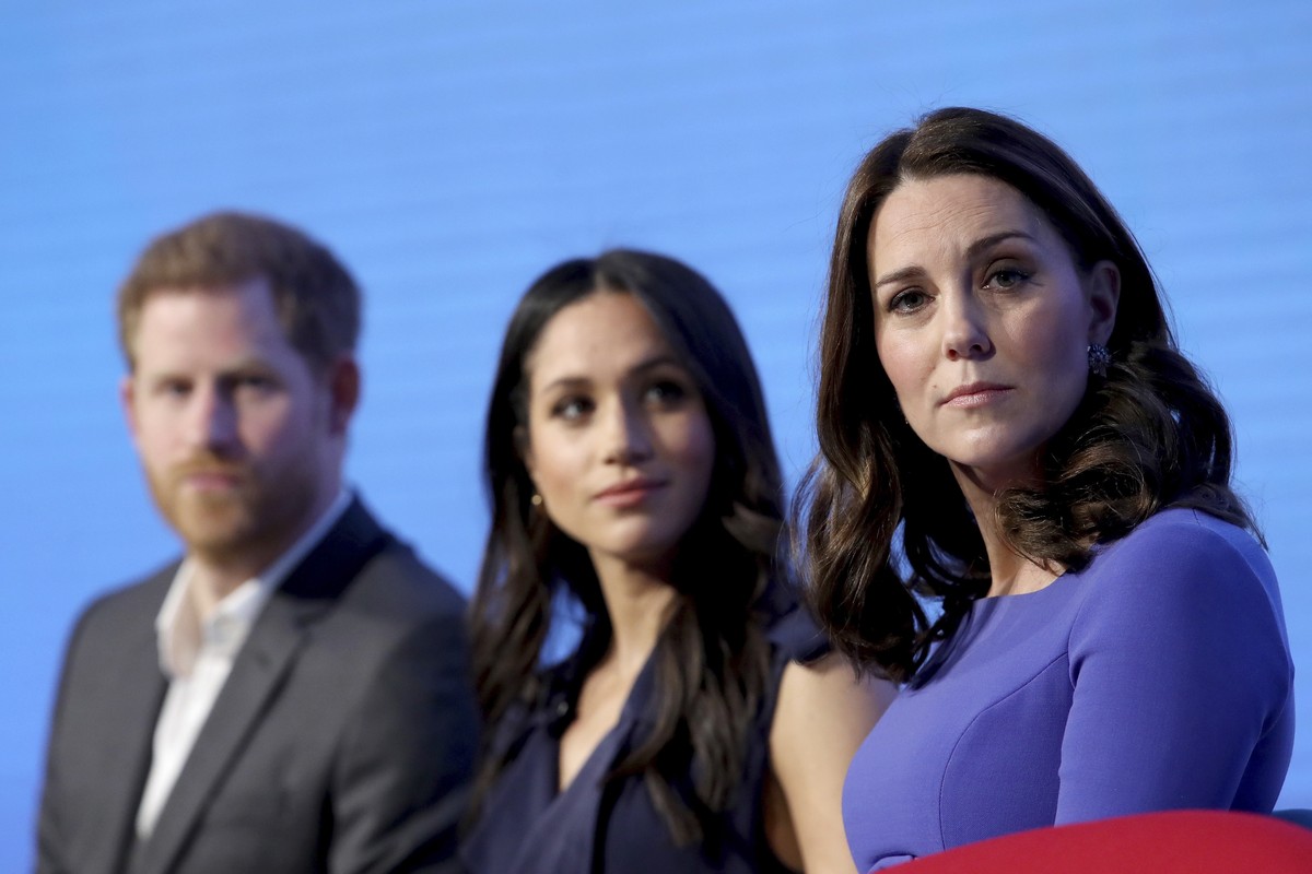 FILE - In this Wednesday, Feb. 28, 2018 file photo, Britain's Kate, Duchess of Cambridge, right, with Prince Harry and his fiancee Meghan Markle attend the first annual Royal Foundation Forum in ...