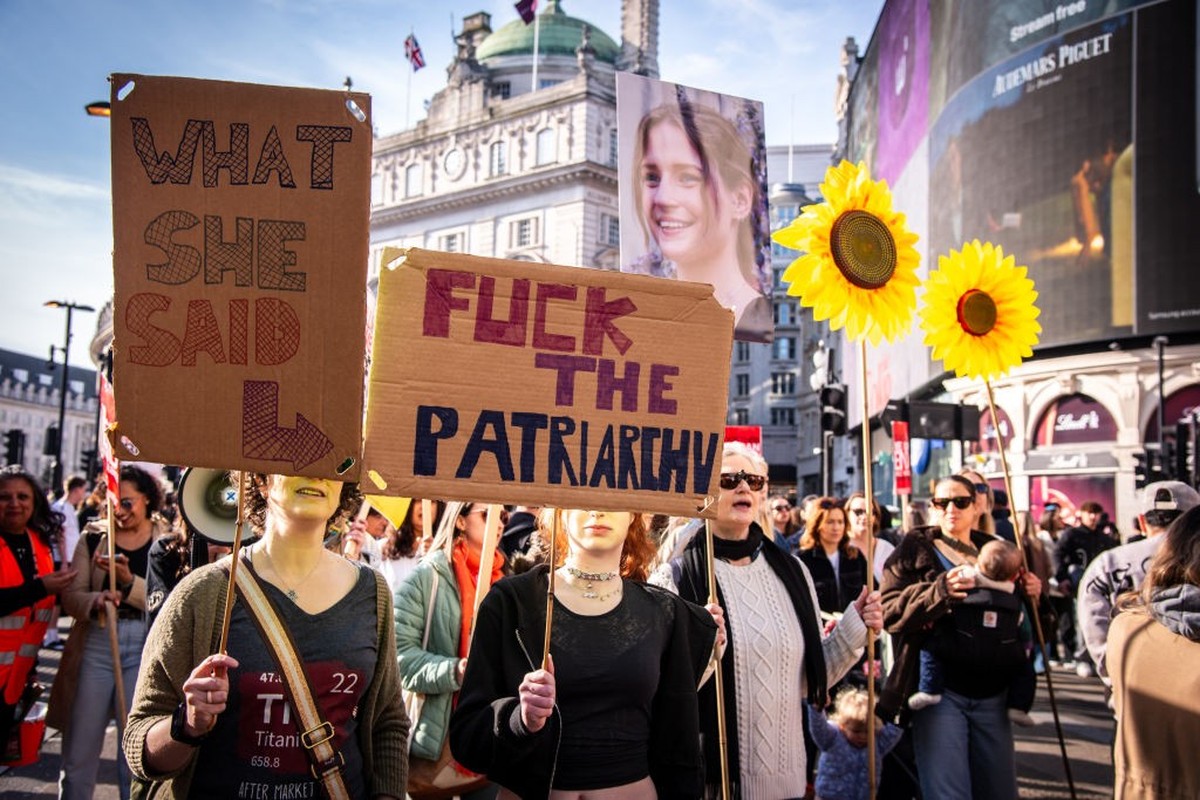 LONDON, UNITED KINGDOM - 2025/03/08: (EDITOR&#039;S NOTE: Image contains profanity) 
Protesters hold placards during the 18th Annual Million Women Rise March and Rally in celebration of International  ...