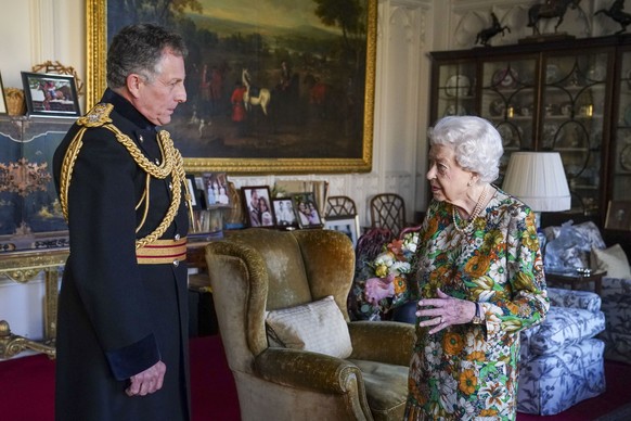 Queen Elizabeth II receives General Sir Nick Carter, Chief of the Defense Staff, left, during an audience in the Oak Room at Windsor Castle, Berkshire, Wednesday Nov. 17, 2021. General Sir Nick is rel ...