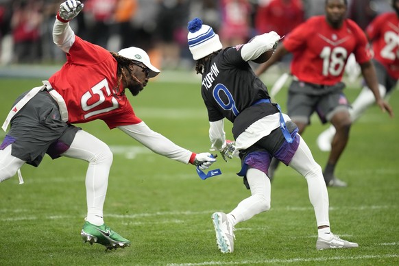 AFC middle linebacker C.J. Mosley of the New York Jets, left, grabs a flag off NFC return specialist KaVontae Turpin (9) of the Dallas Cowboys during the flag football event at the NFL Pro Bowl, Sunda ...