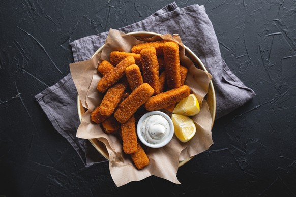 Fish sticks with sauce on the table