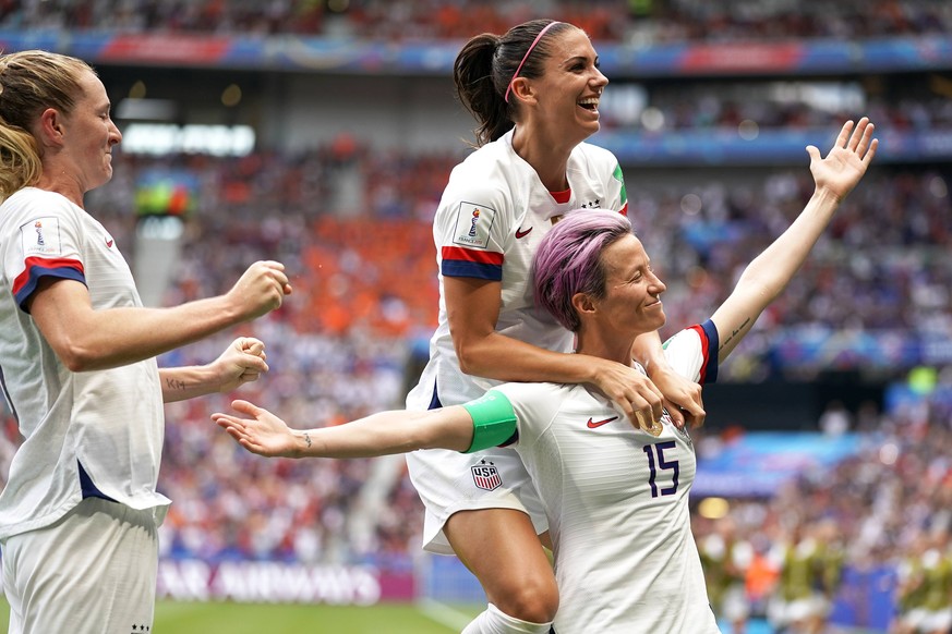 USA v Netherlands - FIFA Women s World Cup 2019 - Final - Stade de Lyon USA s Megan Rapinoe (right) celebrates scoring her side s first goal of the game from the penalty spot with team-mate Alex Morga ...