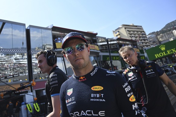 Red Bull driver Sergio Perez of Mexico walks on the side of the track after crashing out of the Formula One qualifying session, at the Monaco racetrack, in Monaco, Saturday, May 27, 2023. The Monaco F ...