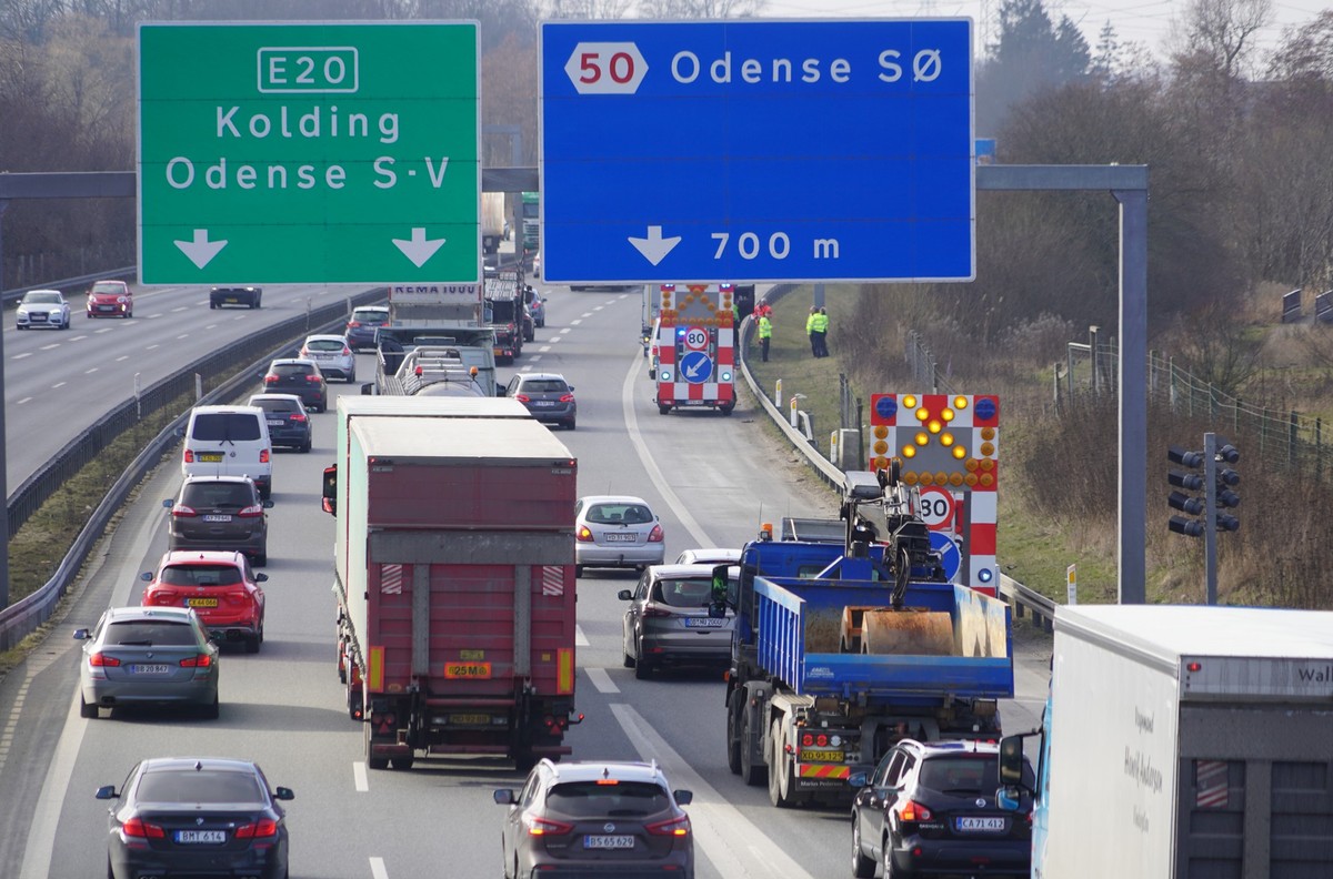 Traffic and warning signs on highway near Odense, Denmark