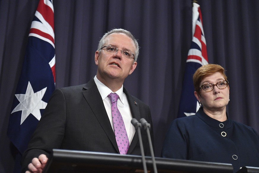 Prime Minister Scott Morrison, left, speaks to the media alongside Minister for Foreign Affairs Marise Payne during a press conference at the Parliament House in Canberra, Tuesday, October 16, 2018. M ...