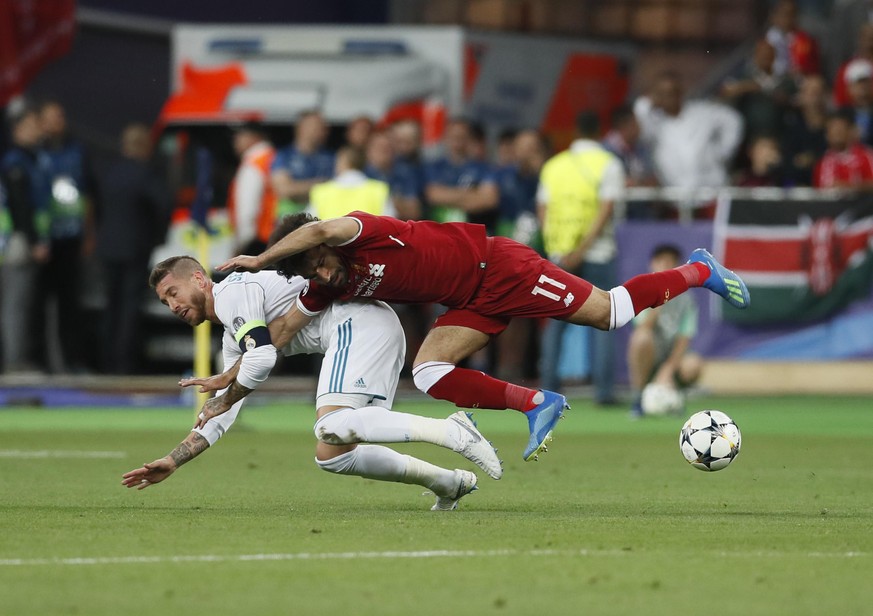 May 26, 2018 - Kiev, United Kingdom - Sergio Ramos of Real Madrid tackles Mohamed Salah of Liverpool during the UEFA Champions League Final match at the NSK Olimpiyskiy Stadium, Kiev. Picture date 26t ...