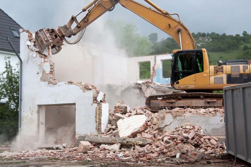 house demolition with bulldozer