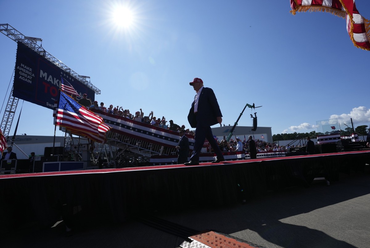 Republican presidential nominee former President Donald Trump walks from the stage after speaking at a campaign rally at Wilmington International Airport, Saturday, Sept. 21, 2024, in Wilmington, N.C. ...