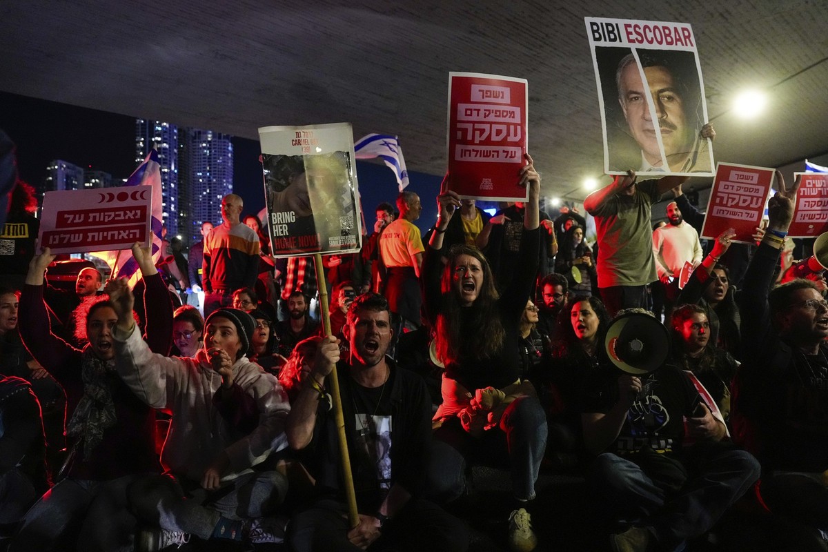 Relatives and supporters of the Israeli hostages held in the Gaza Strip by the Hamas militant group block a road during a rally calling for their release, in Tel Aviv, Israel, Saturday, March 16, 2024 ...