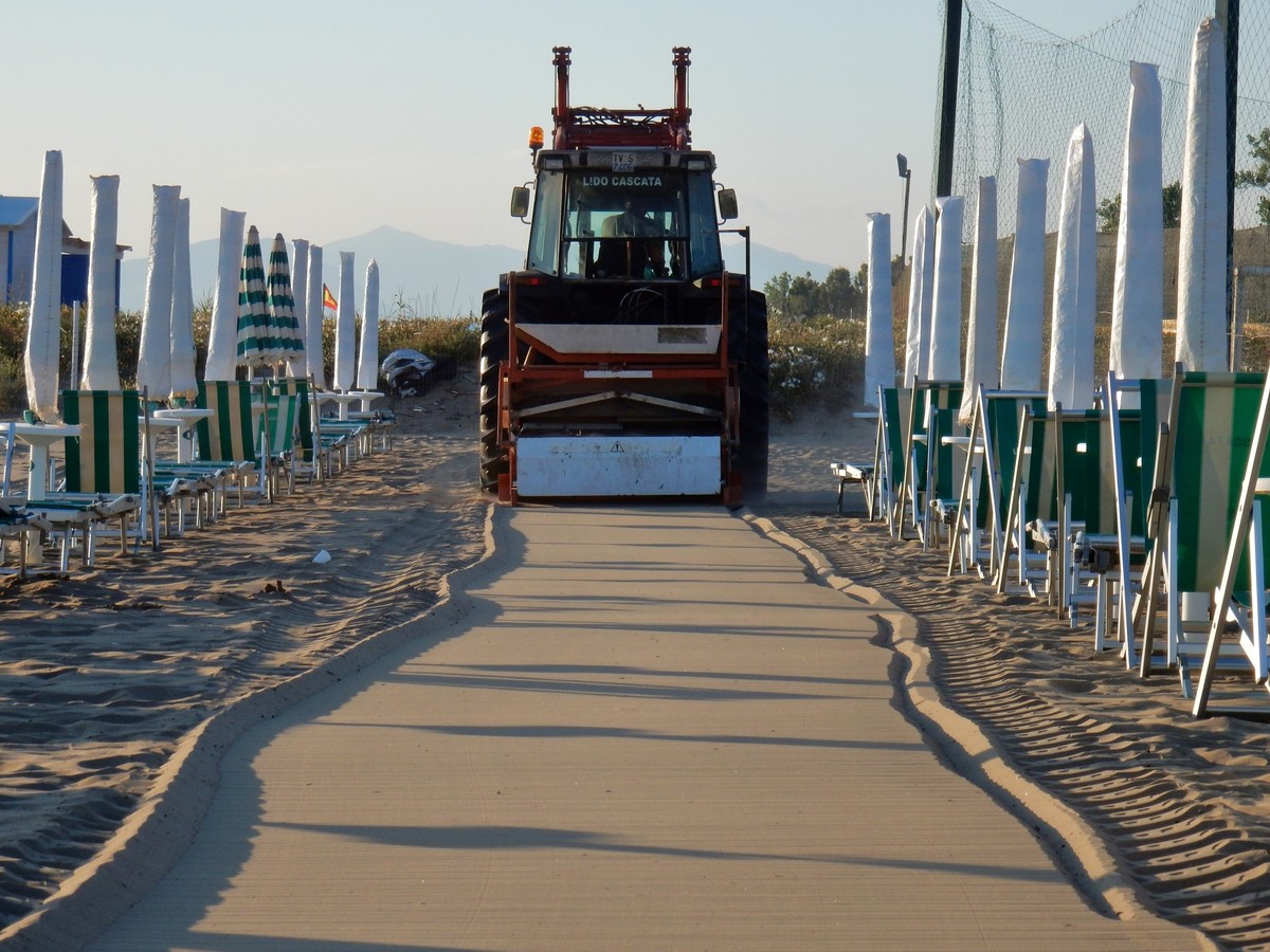 Capaccio, Salerno, Campania, Italy - June 28, 2018: Tractor on the sand during the maintenance of the beach