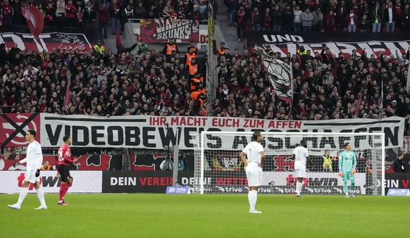 Leverkusen supporters hang a banner reading &quot;remove the video referee&quot; during the German Bundesliga soccer match between Bayer Leverkusen and Bayern Munich in Leverkusen, Germany, Sunday, Ma ...