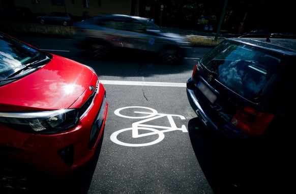 BERLIN, GERMANY - JUNE 27: Cars are parked on a bike path in Ollenhauerstrasse in Berlin Reinickendorf on June 27, 2023 in Berlin, Germany. The new traffic administration in Berlin has stopped various ...