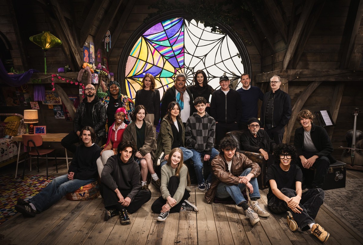 Wednesday. (L to R) Georgie Farmer, Victor Dorobantu, Luyanda Unati Lewis-Nayo, Joy Sunday, Owen Painter, Emma Myers, Billie Piper, Jenna Ortega, Evie Templeton, Luis Guzmán, Isaac Ordonez, Catherine ...