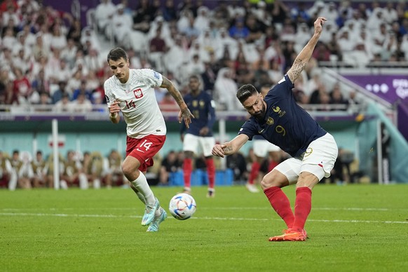 France's Olivier Giroud scores the opening goal during the World Cup round of 16 soccer match between France and Poland, at the Al Thumama Stadium in Doha, Qatar, Sunday, Dec. 4, 2022. (AP Photo/Ebrah ...