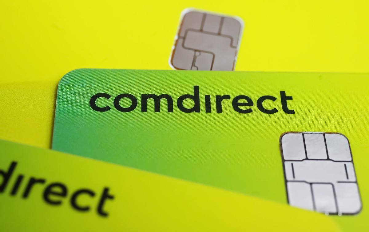 Versen, Germany - July 9. 2022: Closeup of yellow comdirect maestro and credit cards with chip