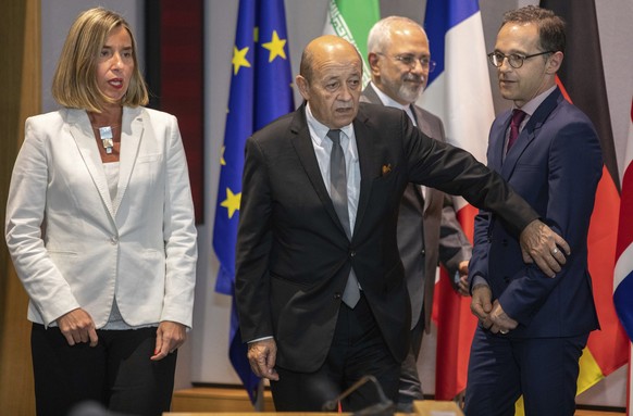 From left, European Union foreign policy chief Federica Mogherini, French Foreign Minister Jean-Yves Le Drian, Iranian Foreign Minister Javad Zarif and German Foreign Minister Heiko Maas take their pl ...
