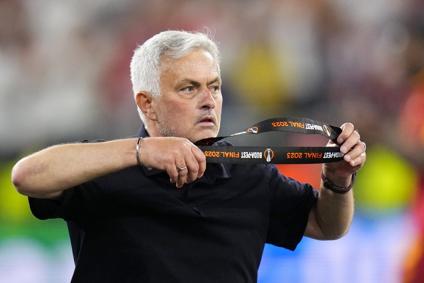 Roma&#039;s head coach Jose Mourinho takes off his second place medal after receiving it at the end of the Europa League final soccer match between Sevilla and Roma, at the Puskas Arena in Budapest, H ...