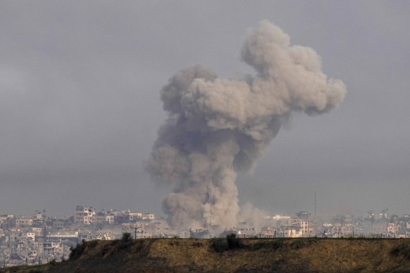 Smoke rises following an Israeli bombardment in the Gaza Strip, as seen from southern Israel, Wednesday, Dec. 27, 2023. The army is battling Palestinian militants across Gaza in the war ignited by Ham ...