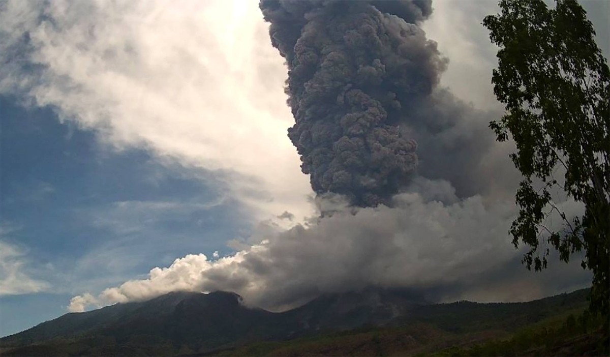 241108 -- EAST NUSA TENGGARA, Nov. 8, 2024 -- This photo provided by Indonesia s Center for Volcanology and Geological Hazard Mitigation shows volcanic materials spewing from Mount Lewotobi Laki-Laki  ...