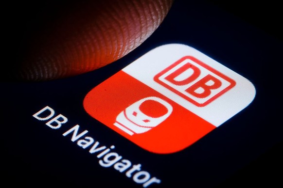 BERLIN, GERMANY - JANUARY 02: In this photo illustration the logo of German railway company Deutsche Bahn (DB Navigator) is displayed on a smartphone on January 02, 2019 in Berlin, Germany. (Photo Ill ...