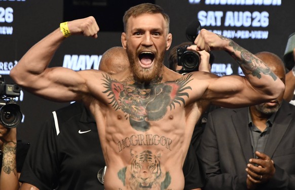 Aug 25,2017. Las Vegas NV. Ireland, s Conor McGregor weighs in at 153 pounds at todays weigh in Friday at the T-Mobile Arena. McGregor will be fighting Floyd Mayweather Jr. August 26th at the T-Mobile ...