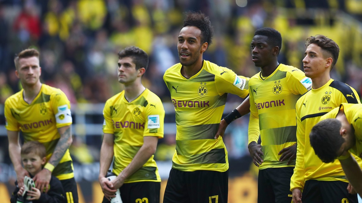 DORTMUND, GERMANY - MAY 20: Sokratis Papastathopoulos, Ousmane Dembele, Christian Pulisic, Raphael Guerreiro, Nuri Sahin and Pierre-Emerick Aubameyang of Borussia Dortmund celebrate in front of the Ko ...