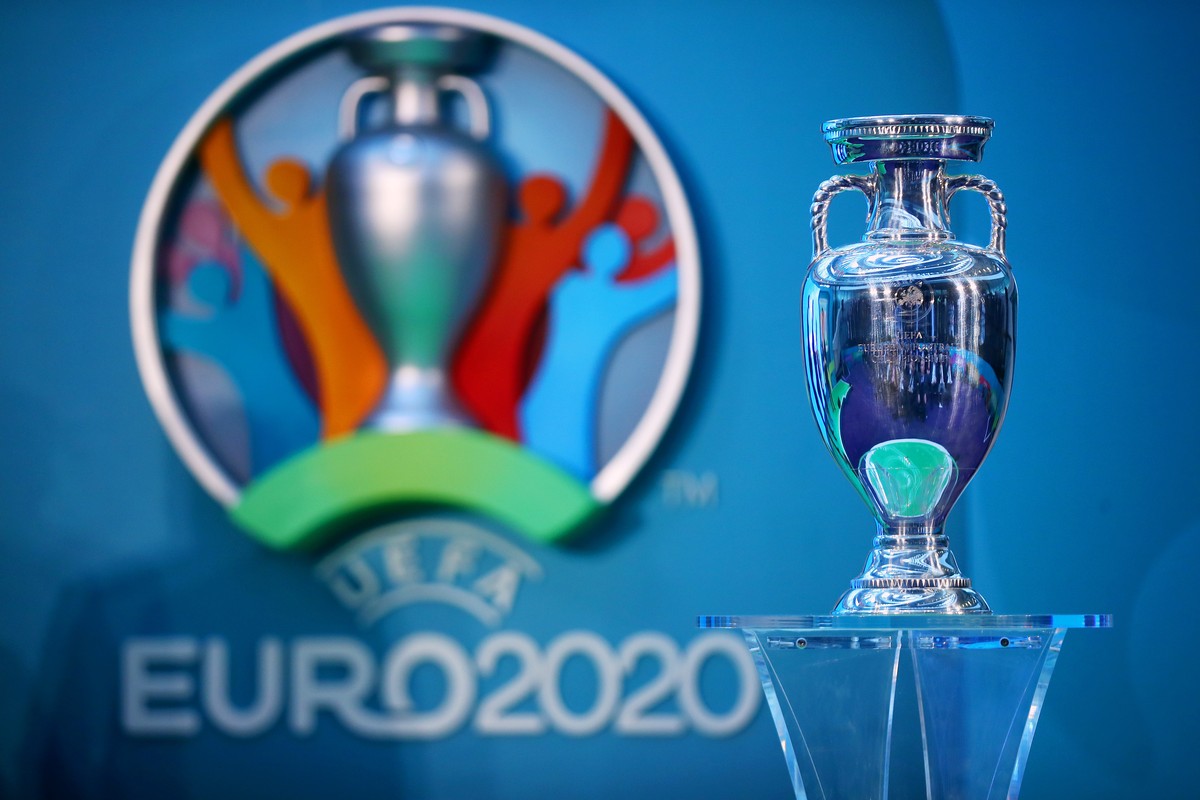 LONDON, ENGLAND - SEPTEMBER 21: The UEFA European Championship trophy is displayed next to the logo for the UEFA EURO 2020 tournament during the UEFA EURO 2020 launch event for London at City Hall on ...