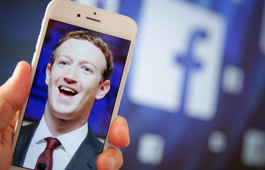 August 28, 2017 - Bydgoszcz, Poland - A portrait of Facebook found Mark Zuckerberg is seen on an iPhone in this photo illustration on 28 August, 2017. Bydgoszcz Poland PUBLICATIONxINxGERxSUIxAUTxONLY  ...