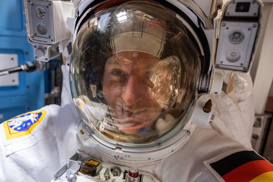 March 23, 2022, Earth Atmosphere: ESA (European Space Agency) astronaut and Expediution 66 Flight Engineer Matthias Maurer spacesuit is pictured in his U.S. spacesuit prior to beginning a spacewalk to ...