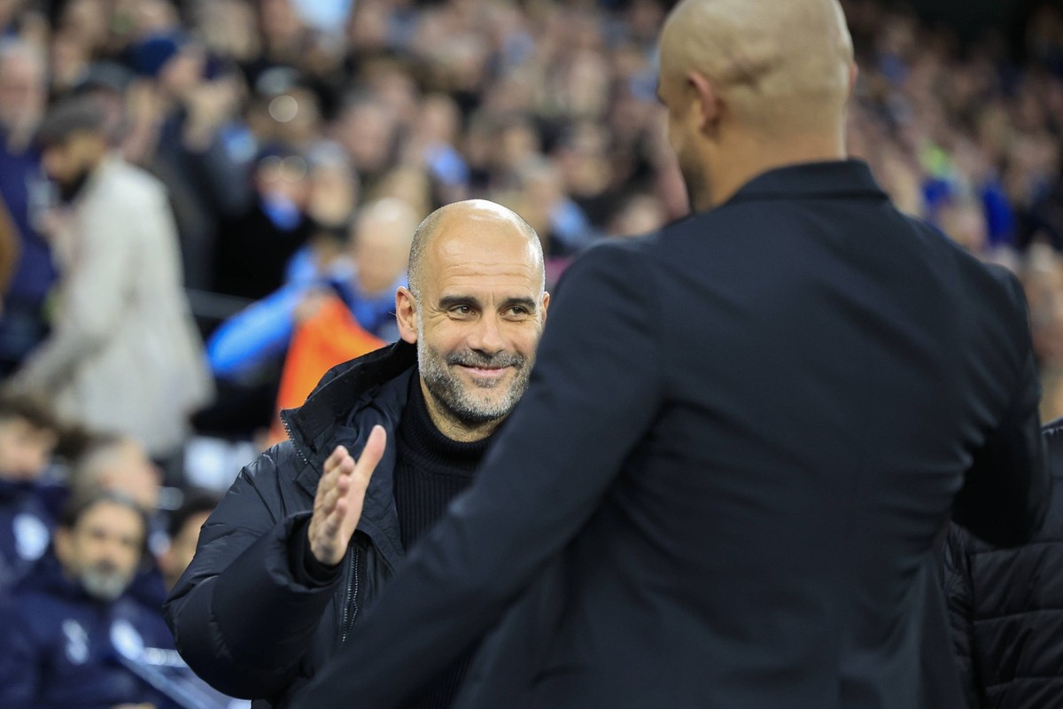 Emirates FA Cup Quarter Final Manchester City v Burnley Pep Guardiola the Manchester City manager welcomes Vincent Kompany the Burnley manager ahead of the Emirates FA Cup Quarter Final match Manchest ...
