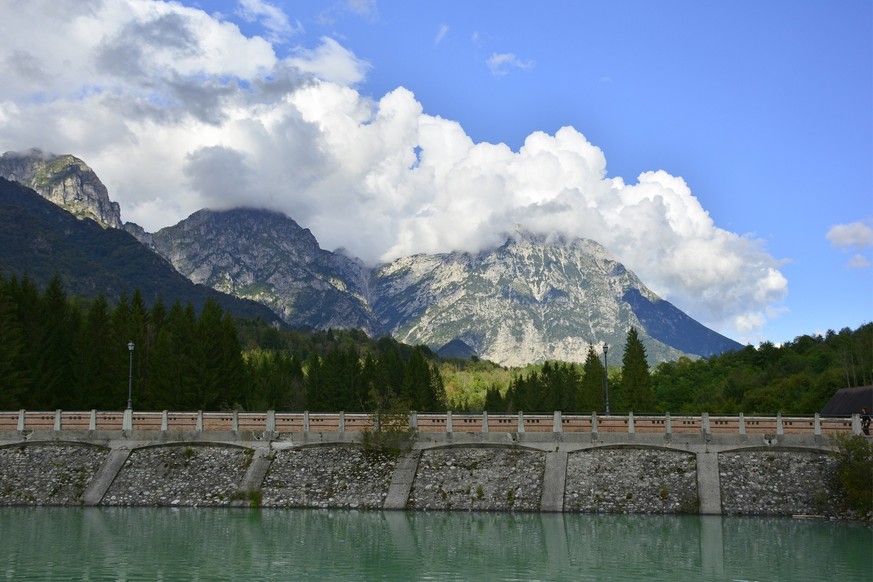 The shore of Lake Barcis in Friuli Venezia Giulia, north east Italy, with the Italian Alps in the background