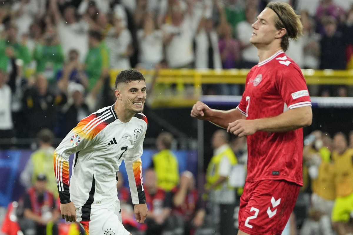 Germany&#039;s Kai Havertz celebrates after scoring his side&#039;s opening goal from a penalty kick next to Denmark&#039;s Joachim Andersen during a round of sixteen match between Germany and Denmark ...