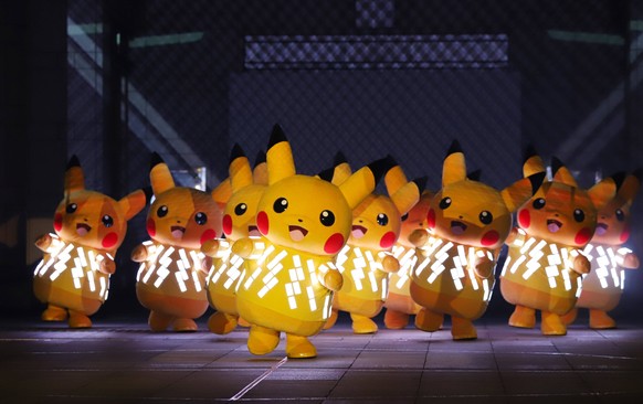 August 8, 2019, Yokohama, Japan - Nintendo s videogame software Pokemon s famous character Pikachu wearing LED illuminations perform for their night show Pikachu Outbreak 2019 in Yokohama, suburban To ...