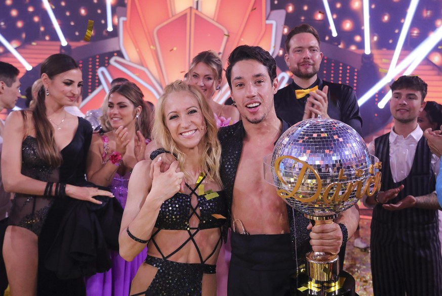 COLOGNE, GERMANY - MAY 20: Kathrin Menzinger and Rene Casselly celebrate winning the final show of the 15th season of the television competition show &quot;Let&#039;s Dance&quot; at MMC Studios on May ...