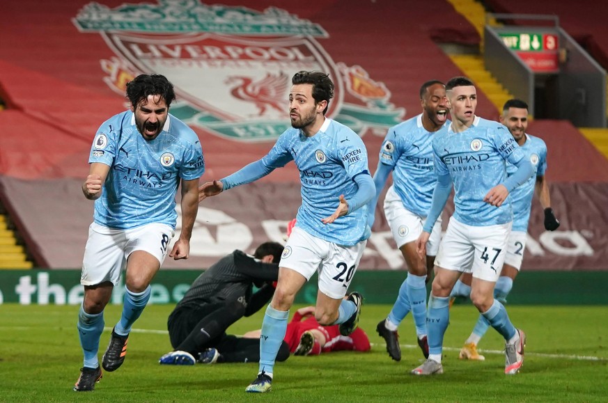 Liverpool v Manchester City - Premier League - Anfield Manchester City s Ilkay Gundogan left celebrates scoring their side s first goal of the game during the Premier League match at Anfield, Liverpoo ...