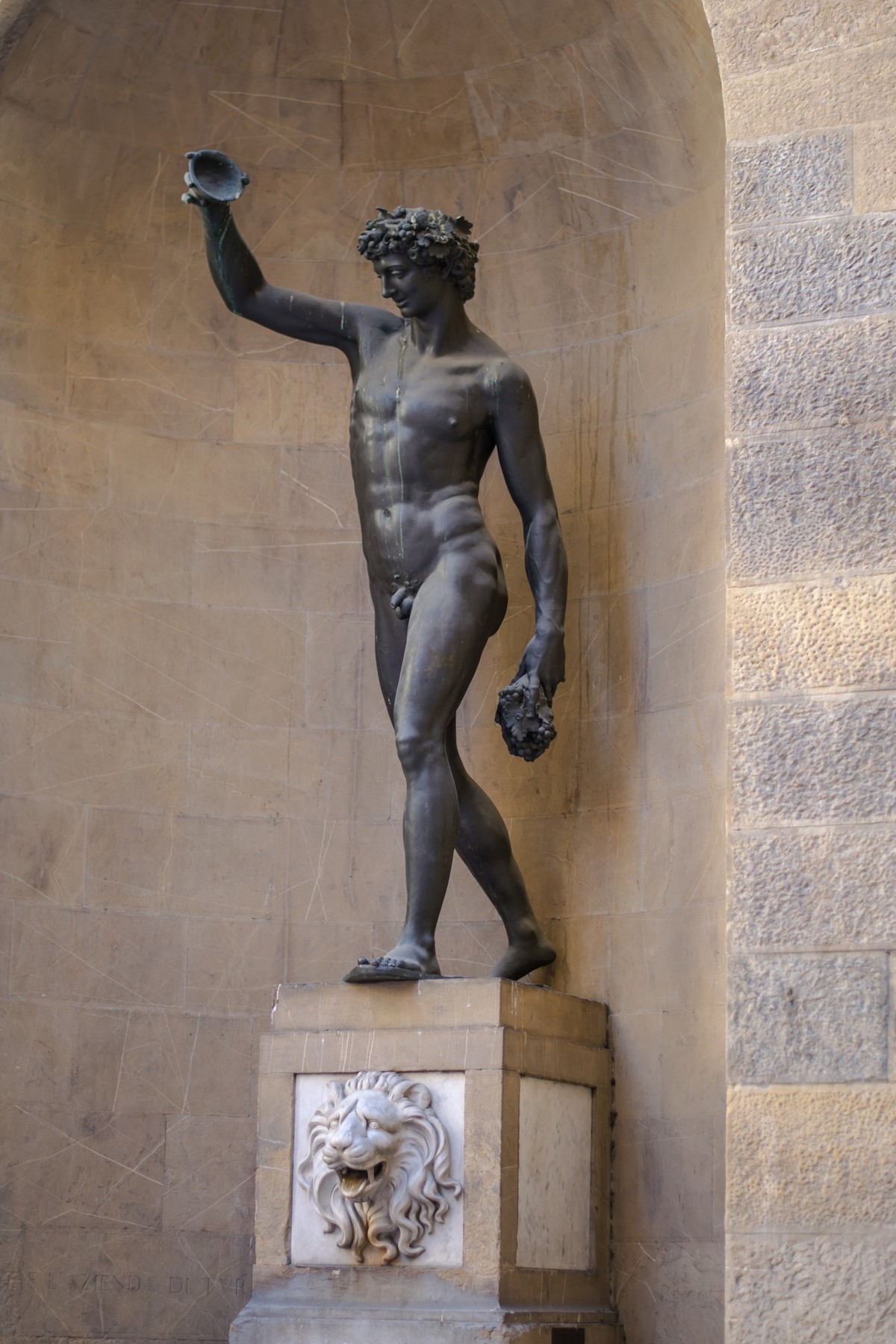 Florence, Italy - 22 April, 2018: copy of sculpture on fountain Del Bacco by Giambologna on Via Borgo San Jacopo, Florence, Italy - 22 April, 2018: copy of sculpture on fountain Del Bacco by Giambolog ...