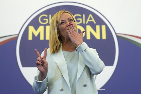 Far-Right party Brothers of Italy&#039;s leader Giorgia Meloni flashes the victory sign at her party&#039;s electoral headquarters in Rome, early Monday, Sept. 26, 2022. Italian voters rewarded Giorgi ...