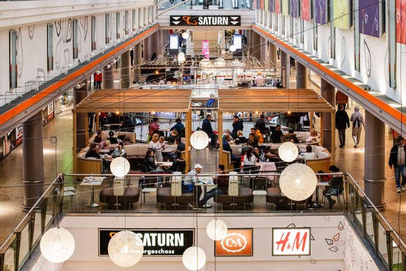 201014 -- BERLIN, Oct. 14, 2020 -- People are seen in the dining area of a shopping mall in Berlin, capital of Germany, on Oct. 14, 2020. New COVID-19 infections in Germany continued to rise, up by 5, ...