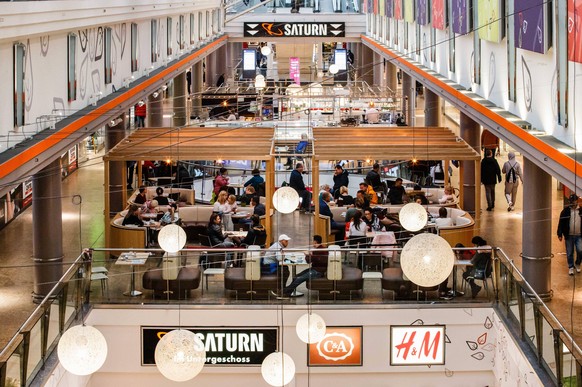 201014 -- BERLIN, Oct. 14, 2020 -- People are seen in the dining area of a shopping mall in Berlin, capital of Germany, on Oct. 14, 2020. New COVID-19 infections in Germany continued to rise, up by 5, ...